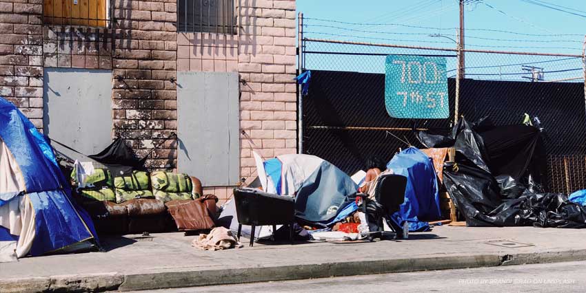 Homeless sheltering in shop entry